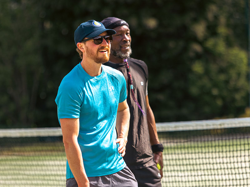 Men playing tennis